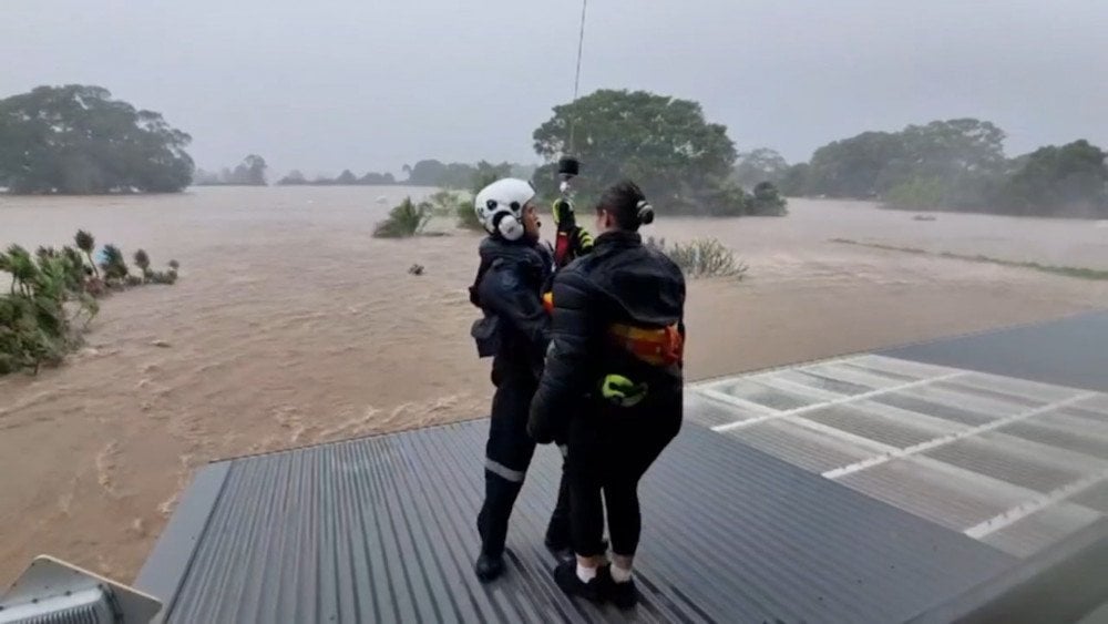 Flooding in Australia, record rainfall in Australia, people rescued from rooftops during flood in Australia