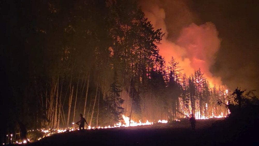 Wildfire in Canada, natural fire in Canada, firefighters battling flames in Canada