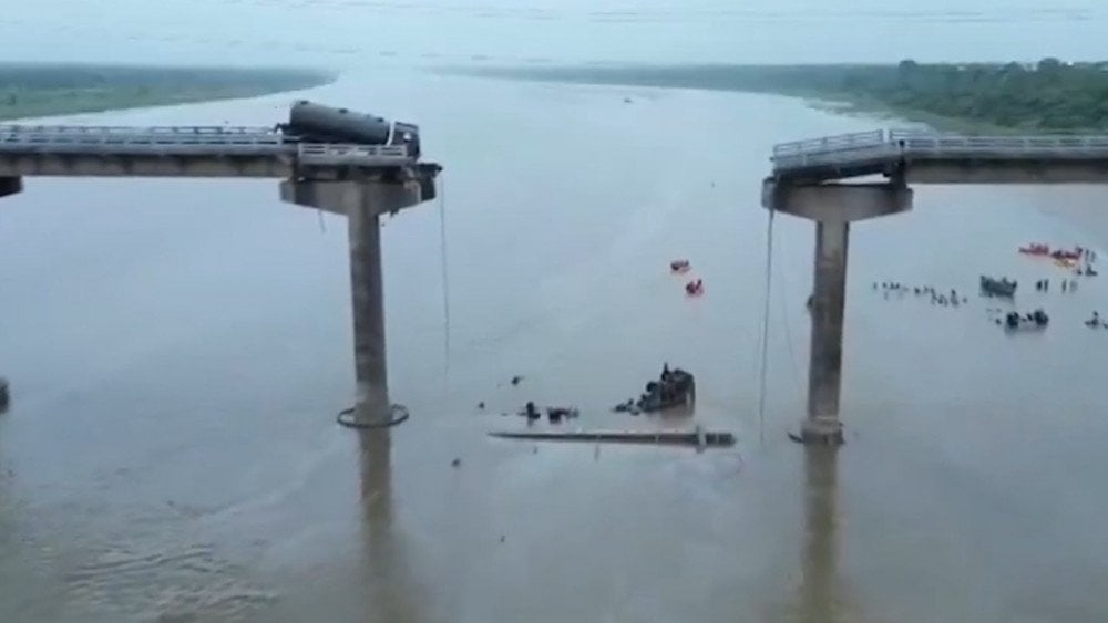Bridge collapse in India, ground tanker left hanging at the edge in India, torrential rains in India